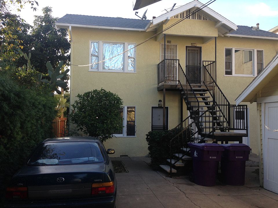 3 unit building behind a house