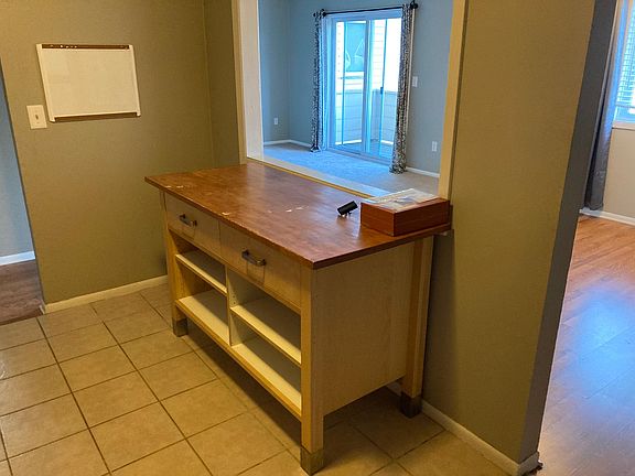 Breakfast table in kitchen with additional storage space