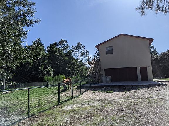 Garage Exterior with fenced yard