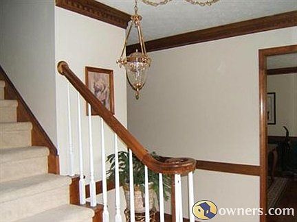 FOYER. HARD WOOD FLOORS +coat closet +bath