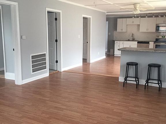 View from front door with doors to Bedroom 1, Hall Bath and Bedroom 2 (Master)