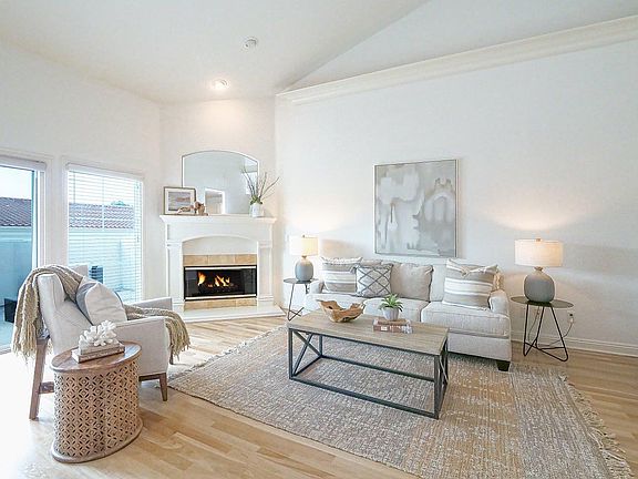 Living area with fireplace (staged)