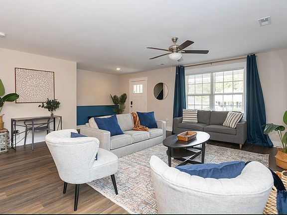 View of living room to front door.