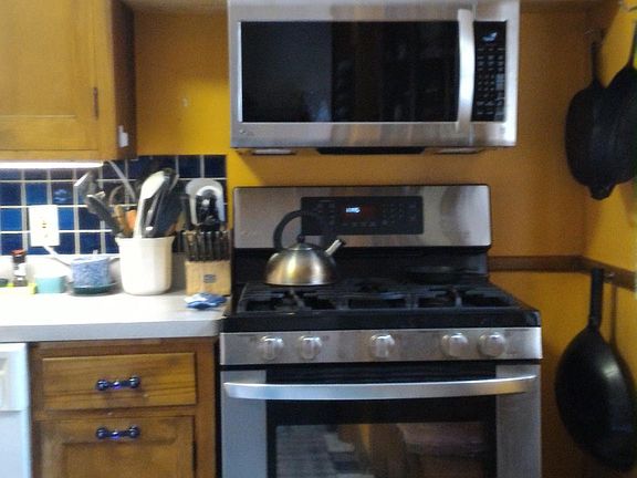 Modern appliances in furnished kitchen