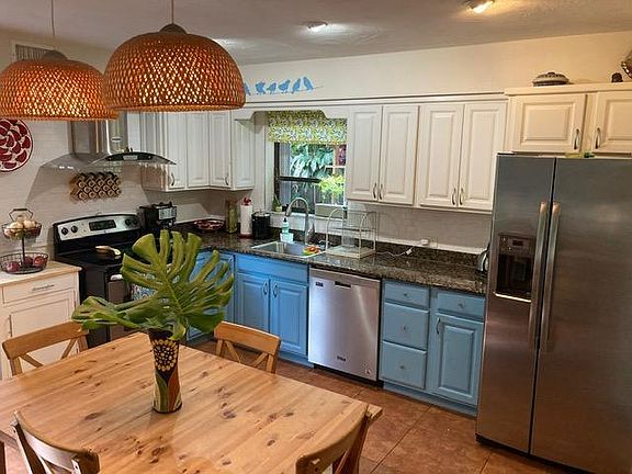 Open kitchen with new appliances and ample space for dining table or kitchen island.