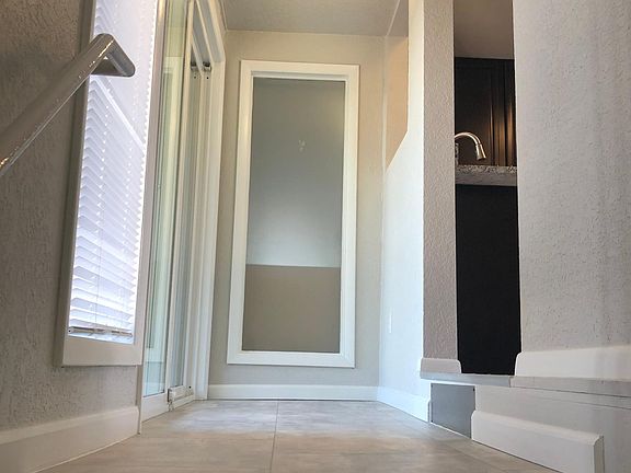 Staircase to main level and Covered Patio