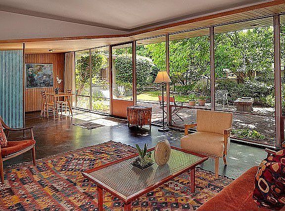 Liv/Din rooms face wall of windows to terrace and private garden. Floors throughout main are polishe