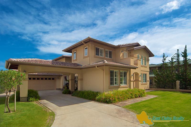 Gated entry leads to this elegant residence with porte cochere, lovely lawns and pretty vistas!