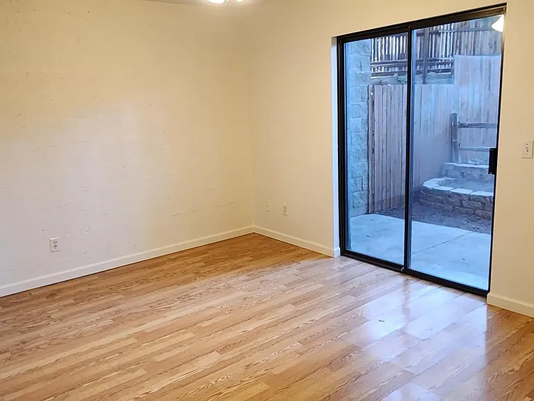 Downstairs bedroom with backyard access