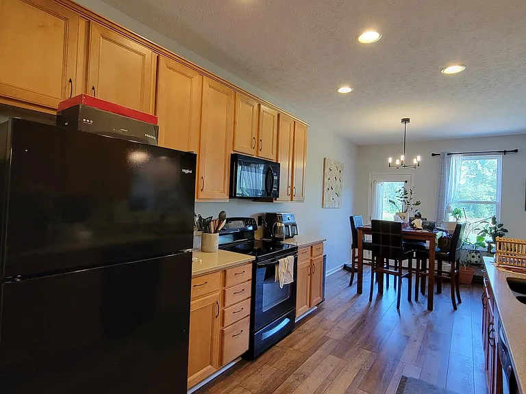 Large open kitchen with plenty of storage and dimmable lights