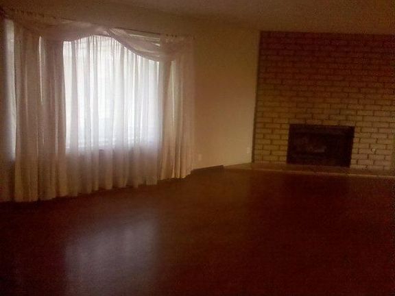 Open living room w/ hard woods