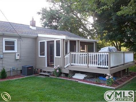 covered deck and hot tud area