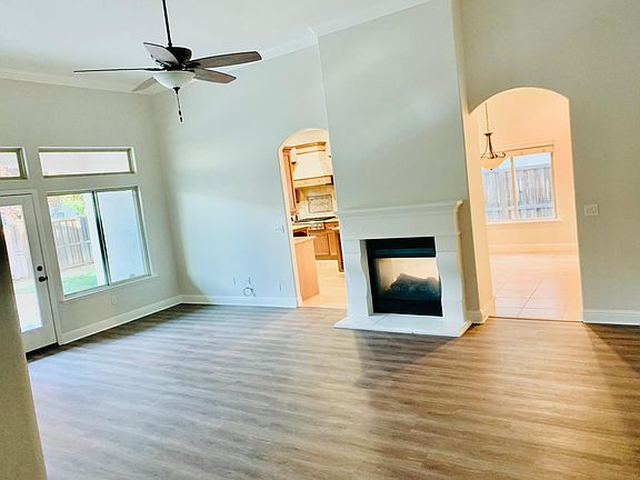 Living area looking into kitchen in backyard