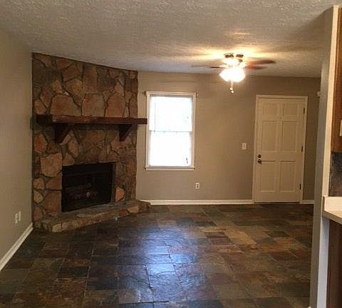 Family room with slate floors and fireplace