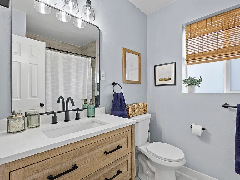 Bright, newly renovated bathroom with full tub + shower.