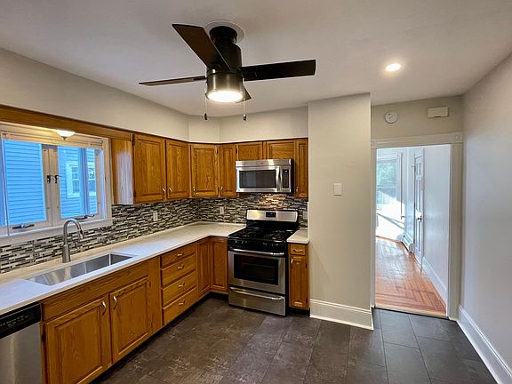 Kitchen - New vinyl flooring, quartz countertops, deep sink, recessed lighting, ceiling fan