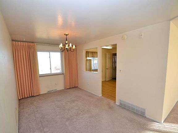 Separate dining room with pass-thru to kitchen