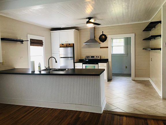 Updated kitchen with stainless appliances, custom cabinets, pantry and dishwasher!
