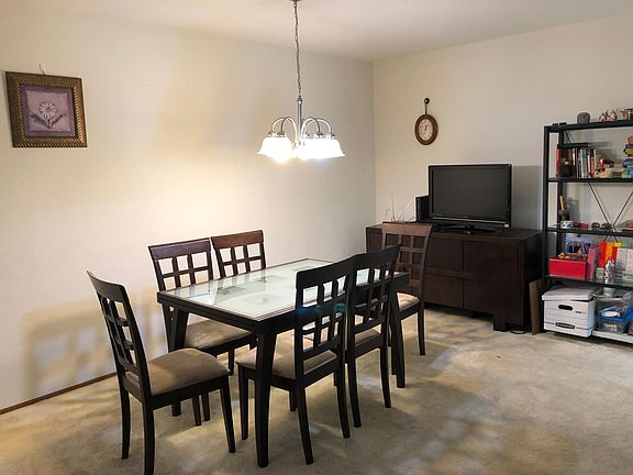 Dining Room (now on Laminate flooring), with room enough for a large dining set, and additional furnishings. Can even fit an office space.