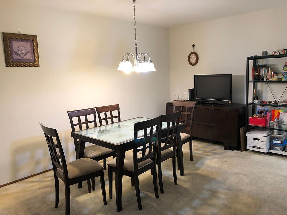 Dining Room (now on Laminate flooring), with room enough for a large dining set, and additional furnishings. Can even fit an office space.