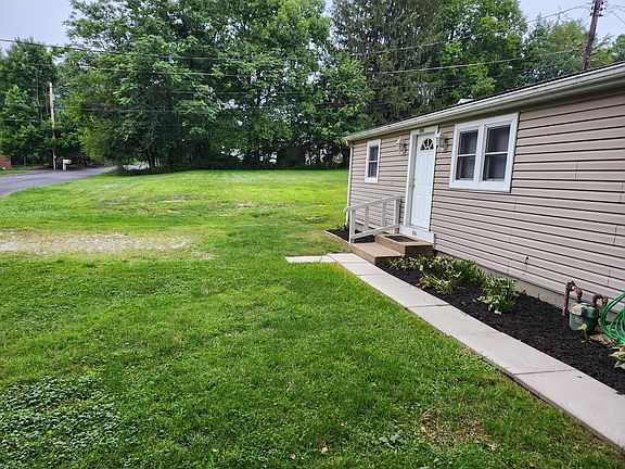 view of empty lot next to house