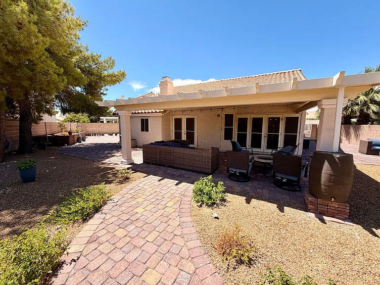 Patio with rain barrel on right side.