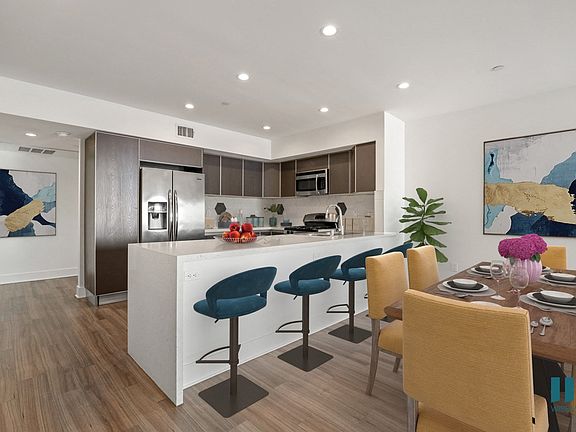 Open-Concept Kitchen with Countertop Bar and Dining Space