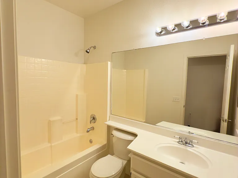 Elegant bathrooms featuring updated tile flooring, modern fixtures, and ample space for comfort and functionality!