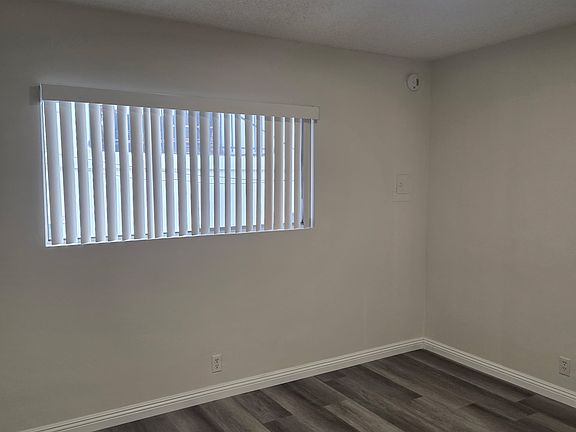 bedroom with laminate flooring