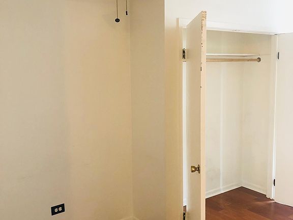 Large closet beside what could be a desk/office space or TV entertainment center area