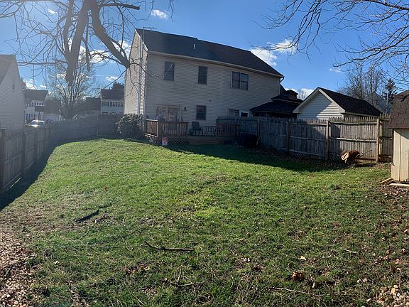 Fenced yard shed and deck