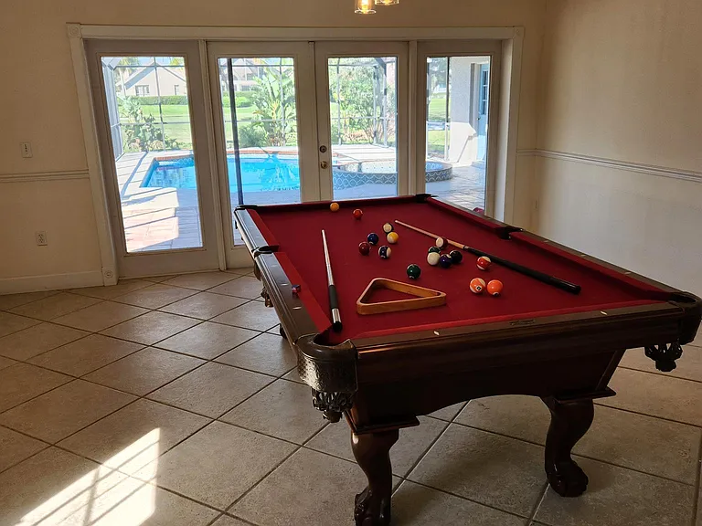 Separate game room with beautiful pool view