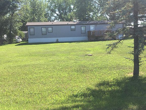 Huge yard with shed for storage.