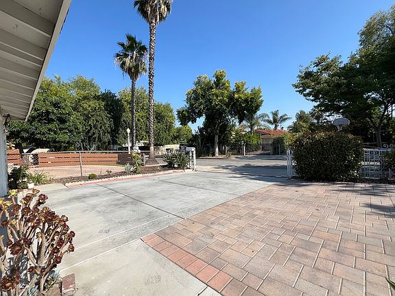 Front yard and tree lined neighborhood