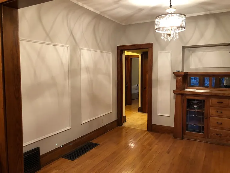 Italian panel paintings were removed and dining room has a more neutral look now.
