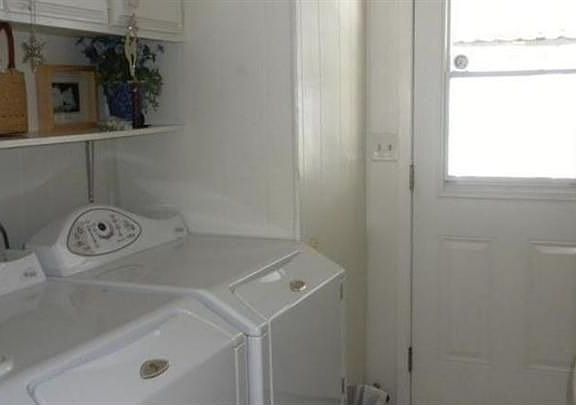 Laundry room comes complete with washer and dryer
