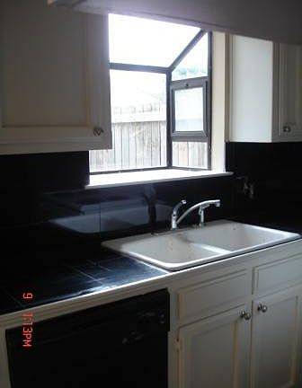 Kitchen with window overlooking back patio
