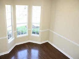 Formal Dining Room with hardwood flooring.
