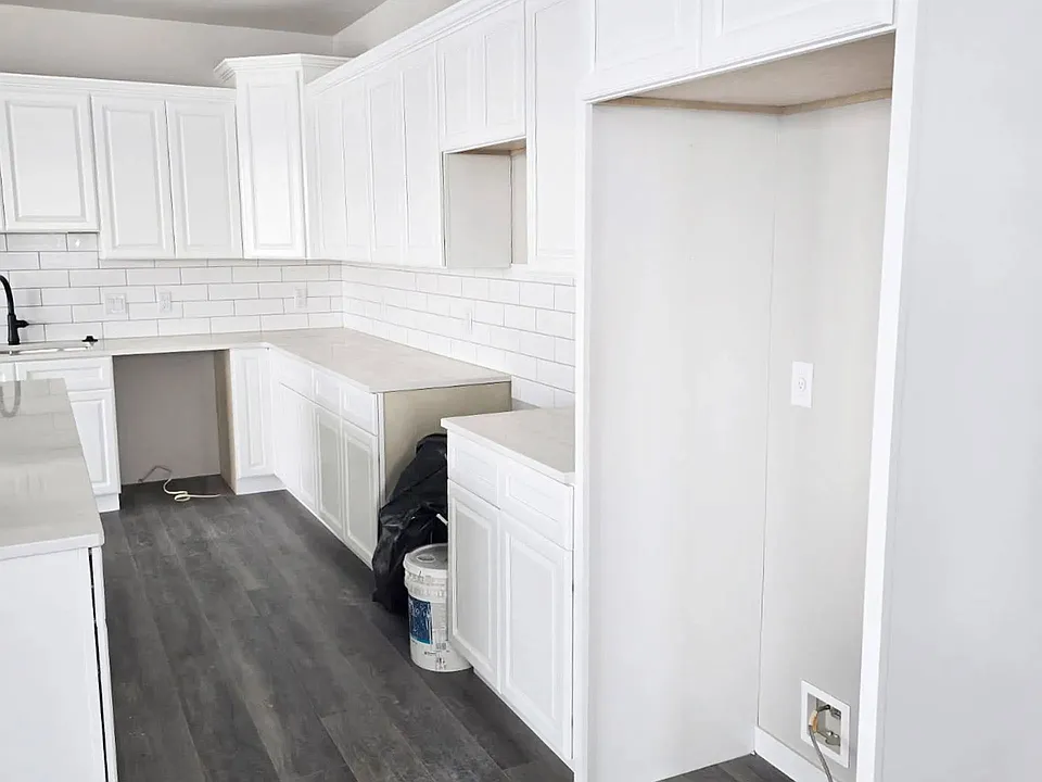 Step into sophistication at Paradise Valley Townhomes. This stunning kitchen features sleek white cabinetry, modern fixtures, and plenty of space for culinary creativity. Embrace a lifestyle of comfort and style. Schedule your tour today!
