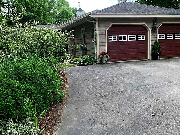 Driveway with room for 4 cars, 2 car attached garage