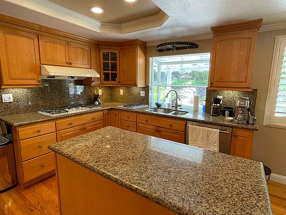 Kitchen with ceiling LED light fixtures.