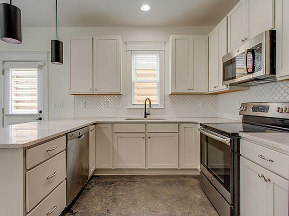 Kitchen equipped with stainless steel appliances.