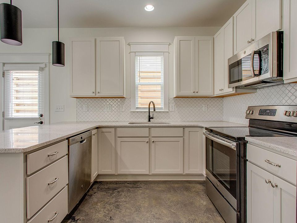 Kitchen equipped with stainless steel appliances.