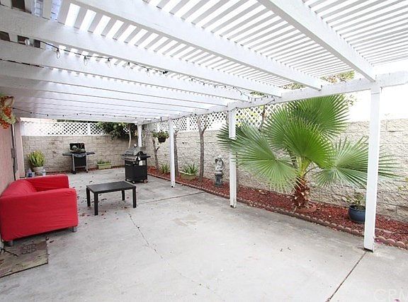 Back yard with patio & fruit trees at different direction.