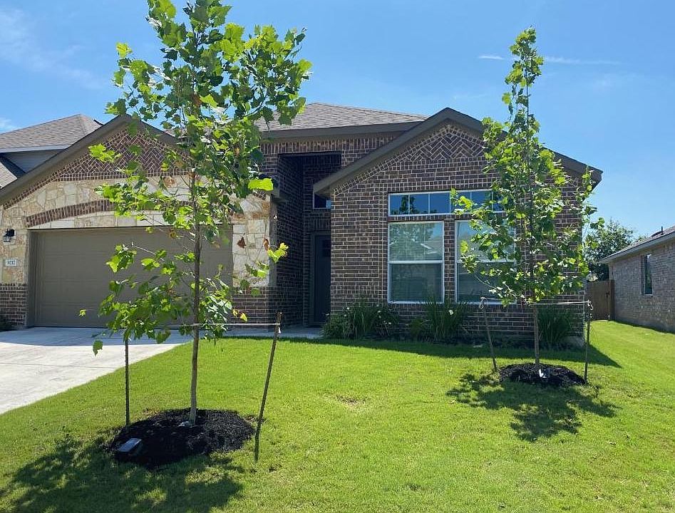 Front of the house, two car garage with large driveway