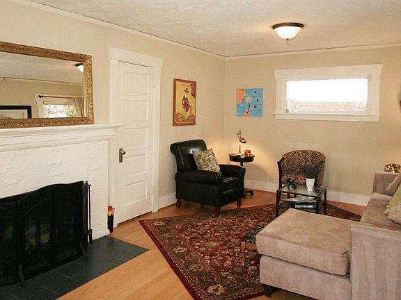 Living room has hardwood floors & fireplace