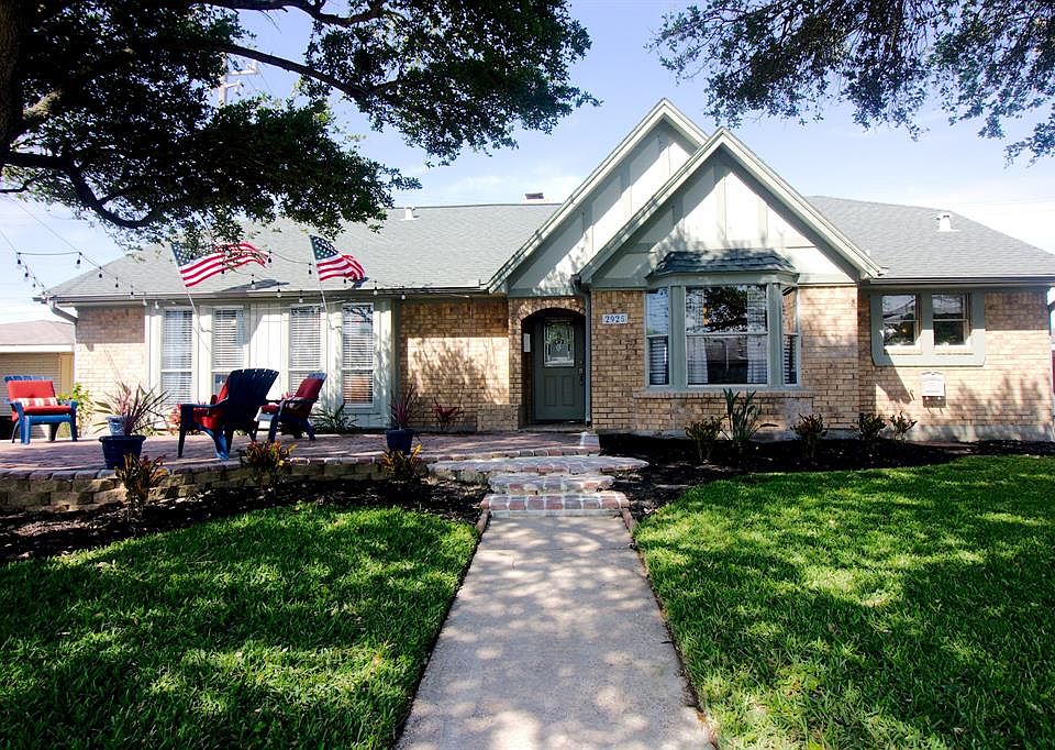 Charming, well-maintained brick home, welcoming curb appeal in mid town