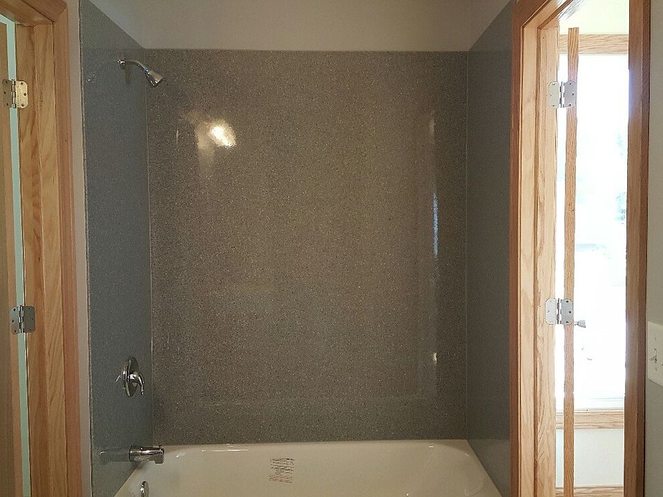 Bathroom with stone shower surround