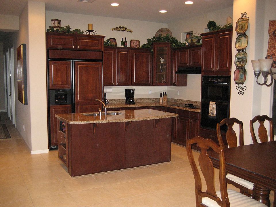 kitchen with granite and built-in fridge