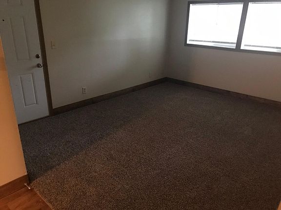 Great sized living room, entrance to interior hallway and washer/dryer area